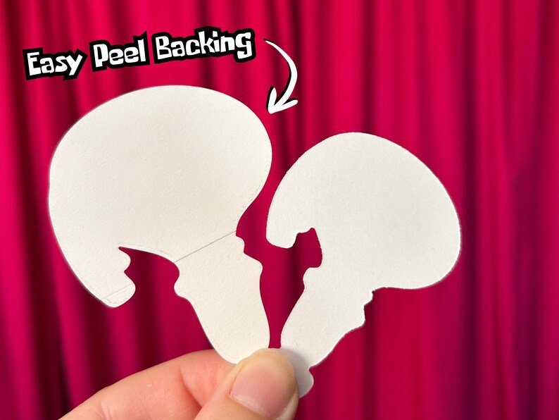 May include: Two white die-cut stickers, shaped like a jellyfish, are held against a bright pink background. The text "Easy Peel Backing" is above the stickers, with an arrow pointing to the top sticker.