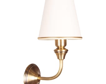 Luxury wall sconce, brass accent light, fabric lampshade, minimalist lighting