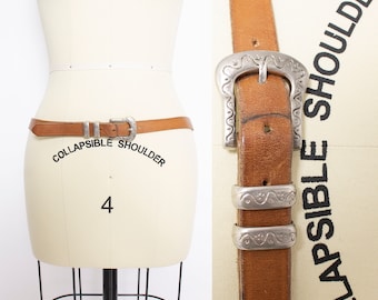 Cintura vintage anni '80 in pelle con fibbia argentata Western L