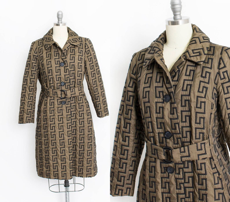 May include: A brown quilted coat with a black geometric pattern and a black belt. The coat has a button closure and a collar.