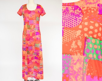 May include: A long, sleeveless maxi dress with a patchwork design in shades of orange, pink, and green. The dress has a scoop neck and a relaxed fit.