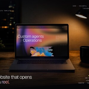 May include: A laptop displaying a website template titled Custom agents for Operations with a colorful abstract graphic. The screen features text including vireo, Framer website template, and A website that opens like a reel, set against a dark background.