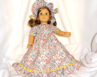 Floral print on light gray, long dress for 18 inch dolls, with yellow baby rick rack trim.