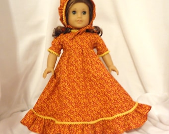 Red and yellow print, long dress for 18 inch dolls, with yellow mini pom pom trim.