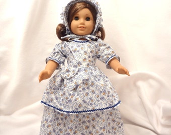 Blue, lavender, gold print on white with blue rick-rack trim, long dress for 18 inch dolls.