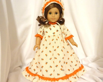 Cream floral print, long dress for 18 inch dolls, with orange lace trim.