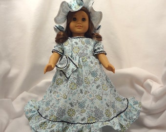 Light blue, spring green, white, and black on pale aqua, long dress for 18 inch dolls, with black baby rick rack..