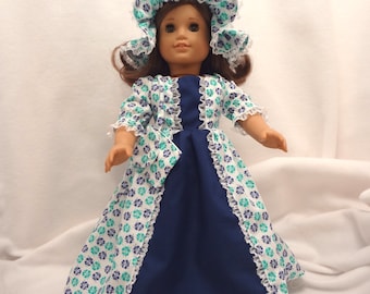 Navy blue and medium green print on white, long dress for 18 inch dolls, with solid navy blue inset and white nylon lace trim.