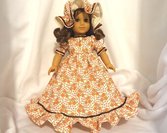 American Girl doll dress, long, ruffled.  Ivory, pink, gold, and brown floral print with brown ribbon trim.