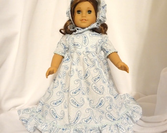 Blue and white paisley print, long dress for 18 inch dolls, with light blue mini pom-pom trim.