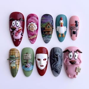 May include: A set of ten press-on nails featuring hand-painted designs inspired by Courage the Cowardly Dog. The artwork includes characters like Courage, Muriel, and Katz, along with iconic imagery such as the farmhouse, a white mask, and signs reading WET DOG, KATZ MOTEL, and HELP ME.