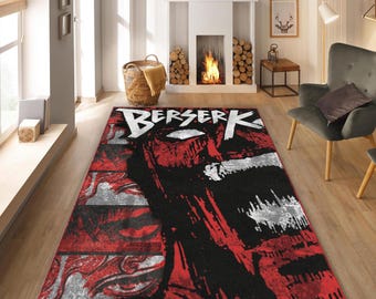 May include: A rectangular area rug featuring a graphic design with the word "BERSERK" in white. The rug's design incorporates red, black, and white elements, creating a bold and striking visual impact. The rug is placed on a wooden floor.