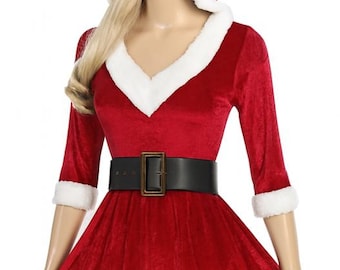 May include: A red velvet Christmas costume with white faux fur trim. The costume features a hooded top with a V-neck, elbow-length sleeves, and a flared skirt. A black belt with a square buckle cinches the waist.