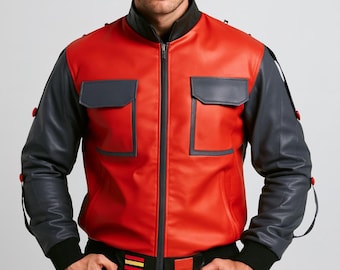 May include: A red and grey leather bomber jacket with a black collar and cuffs. The jacket features two square pockets and a black belt with red and yellow stripes. The sleeves are grey with red button details.