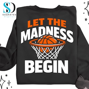 May include: Black sweatshirt with the text "LET THE MADNESS BEGIN" in white and orange. A basketball is shown going into a net. The sweatshirt is a crew neck style.