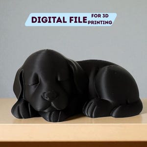 Könnte beinhalten: Eine schwarze, 3D-gedruckte Skulptur eines schlafenden Welpen. Der Welpe liegt mit geschlossenen Augen. Der Text "DIGITAL FILE FOR 3D PRINTING" und "STL + 3MF FILE" ist auf dem Bild zu sehen.