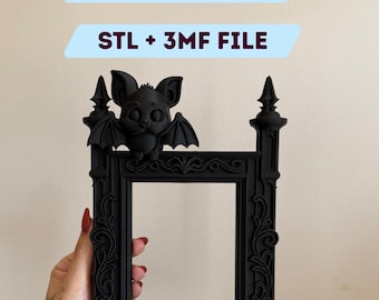 May include: A black decorative frame featuring a bat design. The frame has intricate detailing and a square aperture. Text on the image reads "DIGITAL FILE FOR 3D PRINTING" and "STL + 3MF FILE".