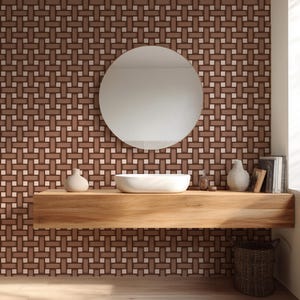 May include: A modern bathroom with a woven pattern wall in shades of brown and cream. A round mirror hangs above a wooden floating shelf with a white sink, vases, and books. A woven basket sits below.