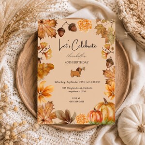 May include: A rectangular birthday invitation card on a light tan background featuring watercolour illustrations of autumn leaves, acorns, and pumpkins. The text reads Let's Celebrate, Elizabeth's 40th Birthday, Saturday September 20th at 4:00 PM, 1234 Maryland road, Fieldsville, and RSVP at 383-384-3828.
