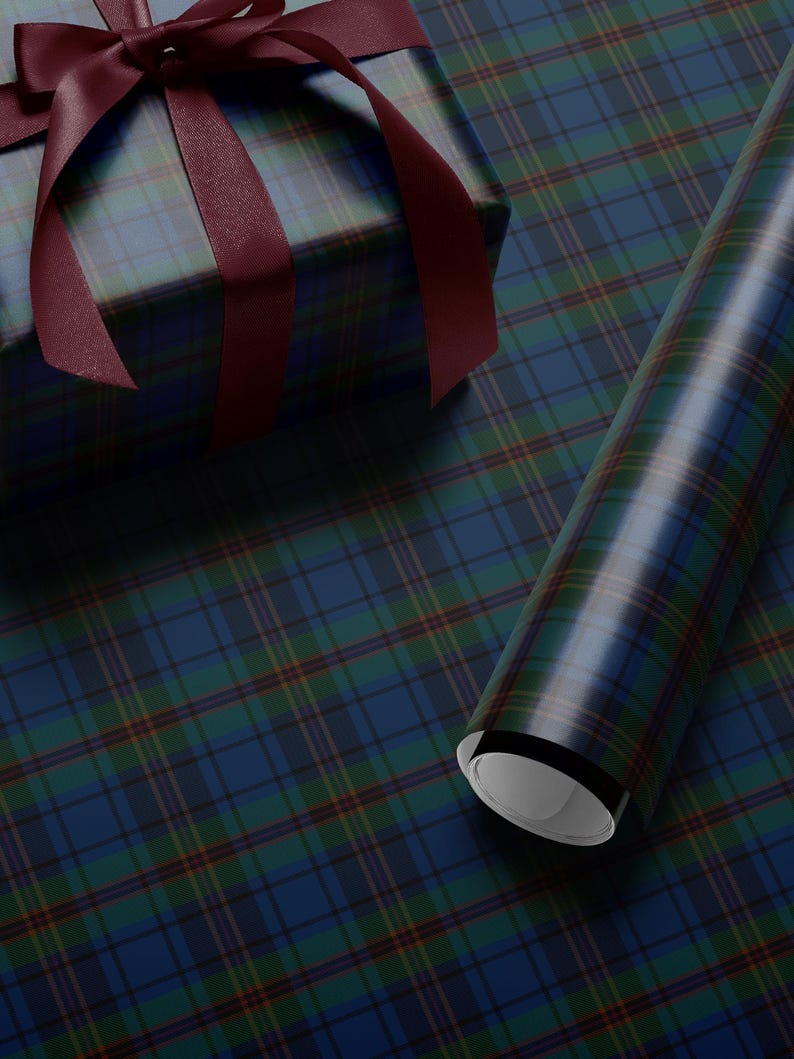 May include: A wrapped gift box with a burgundy ribbon and a roll of matching wrapping paper. The wrapping paper features a blue, green, and red plaid pattern. The ribbon is tied in a bow on top of the box.