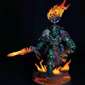 May include: A detailed miniature figure of a warrior in green armor, holding a flaming sword. The figure is surrounded by flames and set against a dark background. The armor has gold and purple accents, and the base is a fiery landscape.