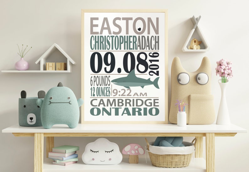 May include: A framed nursery print with a shark graphic and the text "Easton Christopheradach 09.08.2016 6 pounds 12 ounces 9:22 AM Cambridge Ontario".