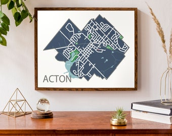 May include: A framed map of Acton, Ontario, with a dark blue background and white lines showing the streets. The word "Acton" is printed in white at the bottom of the map.