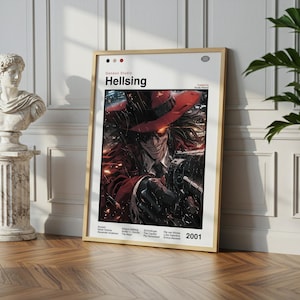 Peut inclure: Affiche encadrée de la série animée "Hellsing". L'œuvre représente un personnage portant un chapeau et un manteau rouges, avec une expression menaçante. L'affiche comprend le titre de la série, le nom du studio et l'année 2001.
