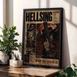 May include: A framed Hellsing poster featuring a dark, illustrated design with the title HELLSING in bold black letters. The artwork includes a central character holding a large firearm, surrounded by smaller panels of characters and text.