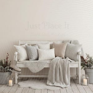 May include: A cozy winter scene featuring a white bench adorned with pillows and a blanket. Decorative elements include a faux fur rug, ice skates, and potted plants with pinecones and berries. The background has a wavy pattern and the text "Just Place It".