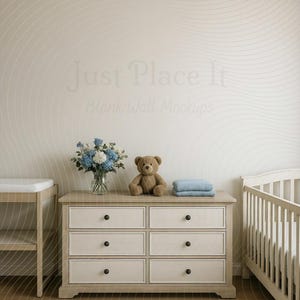 May include: A nursery setting with a light wood chest of drawers with six drawers and black knobs. A teddy bear, blue blanket, and a vase of blue and white flowers are on top. A cot and changing table are also present.