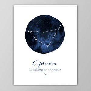 May include: A blue watercolor illustration of the Capricorn constellation with white stars against a dark blue background. The text "Capricorn" is written in blue cursive script below the constellation. The dates "22 DECEMBER / 19 JANUARY" are written in blue below the text "Capricorn".