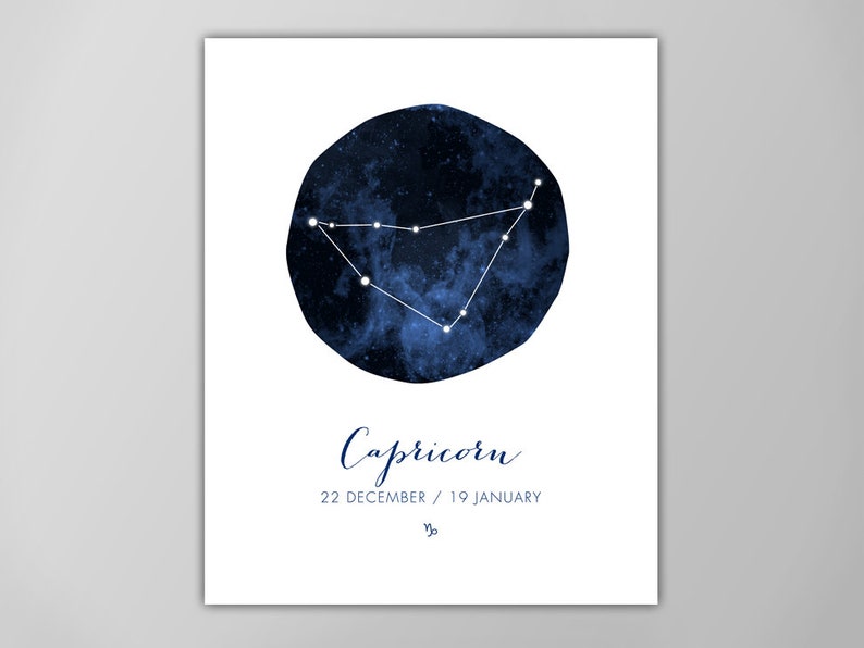 May include: A blue watercolor illustration of the Capricorn constellation with white stars against a dark blue background. The text "Capricorn" is written in blue cursive script below the constellation. The dates "22 DECEMBER / 19 JANUARY" are written in blue below the text "Capricorn".