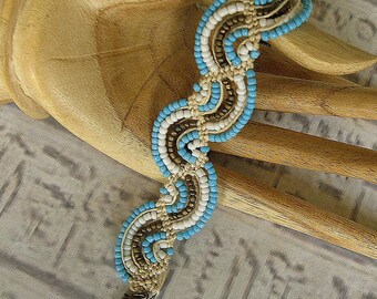 Micro macrame bracelet in waves of turquoise, white and bronze. Hemp bracelet.