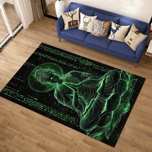May include: A black rectangular rug with a glowing green illustration of a Buddha figure in a meditative pose. The design includes a halo and lotus flower, with a matrix-like pattern. The rug is placed on a wooden floor.