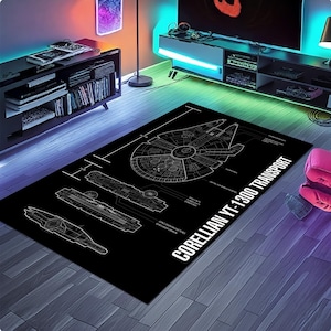 May include: Black rectangular rug featuring a detailed white blueprint design of the Corellian YT-1300 Transport, with the text "Corellian YT-1300 Transport". The rug is placed on a wooden floor.