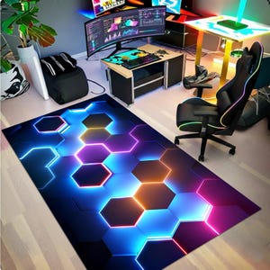 May include: A rectangular area rug with a geometric design featuring glowing hexagonal shapes in shades of blue, purple, and orange. The rug is placed on a light-colored wooden floor, creating a modern and vibrant aesthetic.
