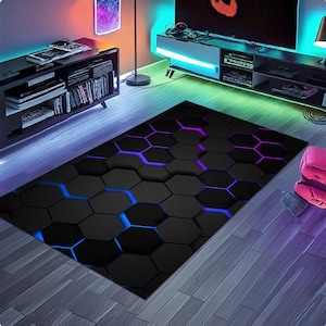 May include: A rectangular black rug with a 3D hexagonal pattern. The rug features blue and purple accent lighting that highlights the geometric design. The rug is placed on a wooden floor, adding a modern touch to the room.