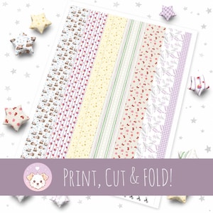 May include: A sheet of patterned paper strips with various designs, including hedgehogs, strawberries, and floral patterns. The text "PRINT, CUT & FOLD!" is displayed. Decorative star-shaped ornaments surround the paper.