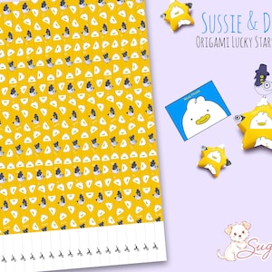 May include: A sheet of yellow paper with a repeating pattern of white and black cartoon characters, featuring the text Sussie & Derpy Origami Lucky Stars Sheets, two folded star shapes, a blue rectangular card, and a small dog illustration.