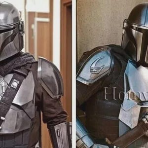May include: A detailed costume of the Mandalorian, featuring a silver helmet, chest plate, and shoulder armor. The outfit includes a dark undersuit and a strap across the chest. The overall design is metallic and futuristic, inspired by the Star Wars series.