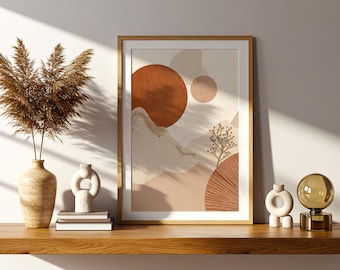 May include: A framed abstract art print with warm earth tones, including shades of orange, beige, and brown. The artwork features a minimalist landscape with circular and organic shapes. The print is displayed on a wooden shelf with decorative vases and a dried plant arrangement.
