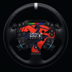 May include: A black racing steering wheel controller featuring a central faceplate with a red and dark blue geometric pattern. The Oracle Red Bull Racing logo is printed in white at the centre, surrounded by various buttons, toggles, and a PlayStation logo.