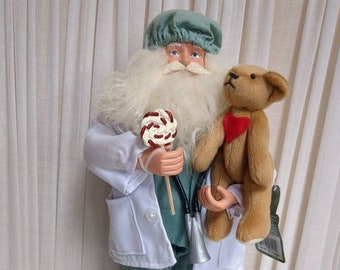 Santa Claus Pediatrician Figurine Offering Gifts to a Little One.