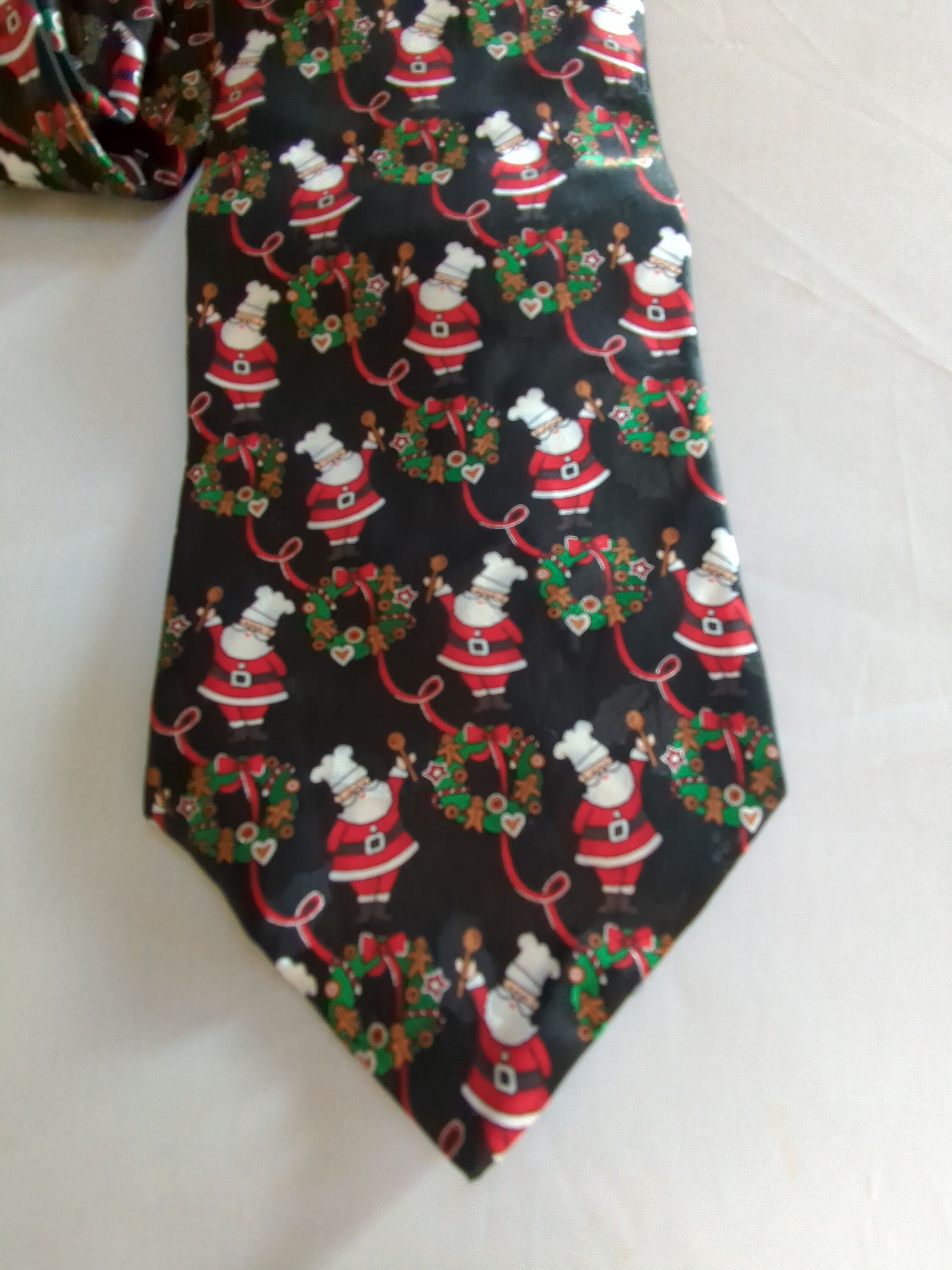 Christmas Ribbon Man Baker Santa Standing Among the Christmas Trees Surrounded by Gold ...