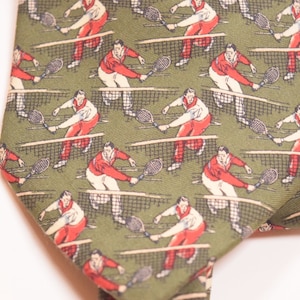 Tennis Tie Mens Novelty Necktie Tie Sage Green with Red and White accents features Tennis Player Design