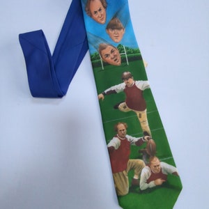The Three Stooges Football Novetly Necktie Features Moe Larry and Curly made by WallyWear Men&#39;s Necktie.