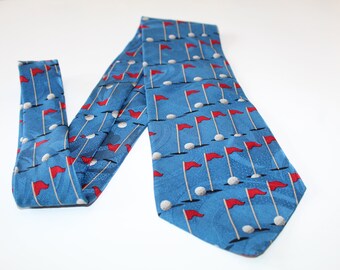 Sink The Putt Necktie Blue 100% Silk Designer Tie with Red White and Black Golf Flags and Golf Ball Pattern by Ralph Marlin