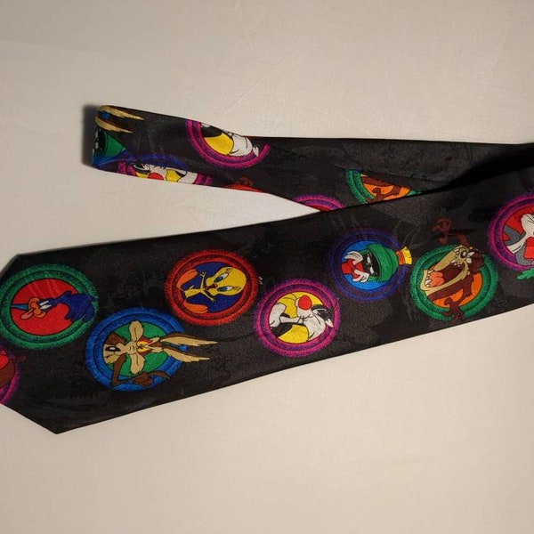 Looney Tunes Necktie features Bugs Bunny Tweety Bird Sylvester the Cat Porky the Pig Elmer Fudd Tasmanian Devil Road Runner Wiley Coyote