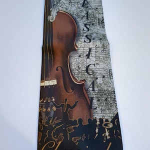 May include: A brown and gold tie featuring a violin, musical notes, and the word "Classical" printed on it.